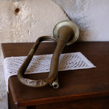 Antique brass bugle – vintage military instrument collectible